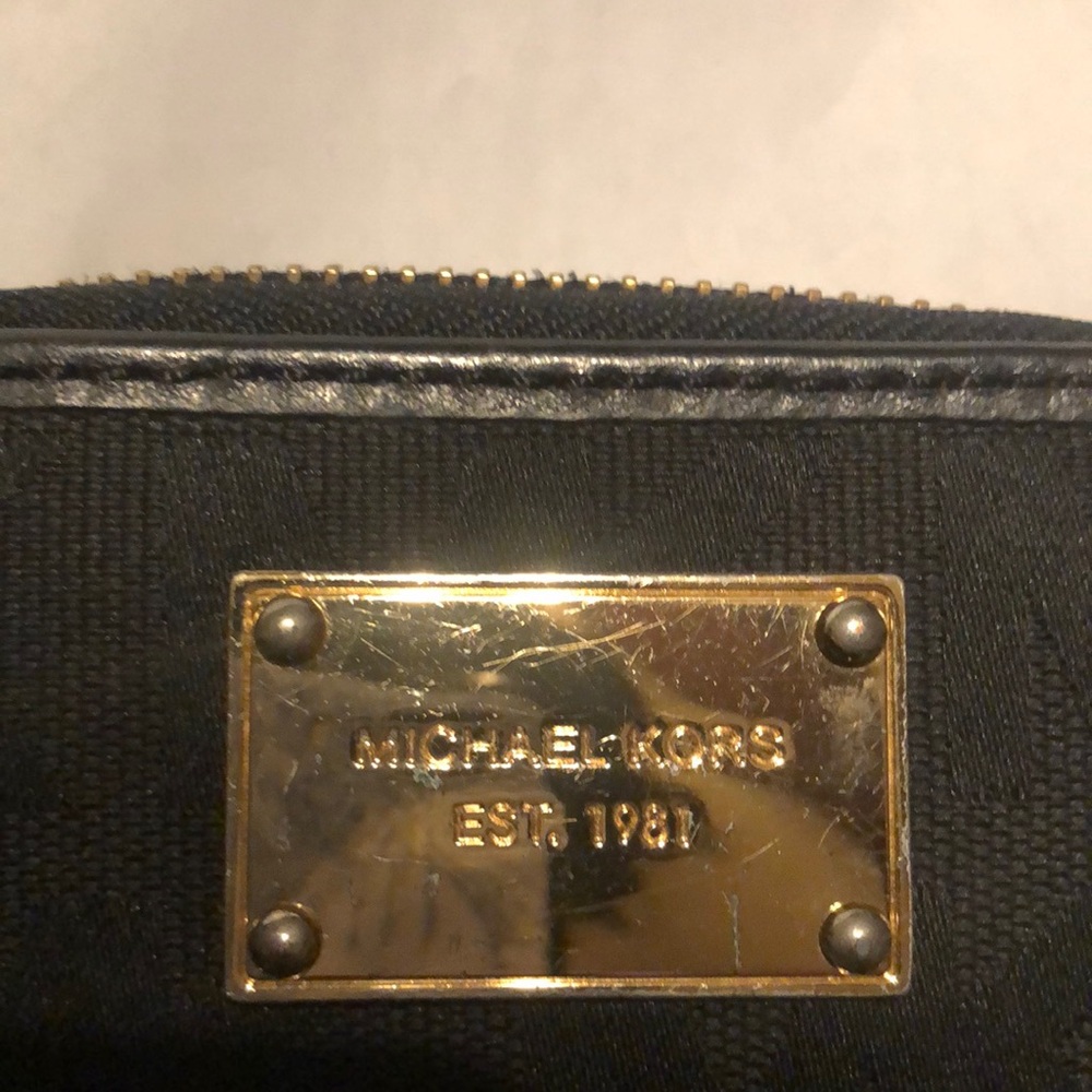 Black and Gold Michael Kors wallet.